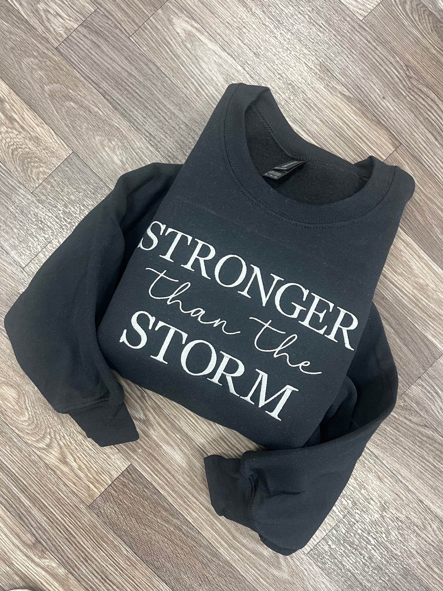 Stronger Than The Storm Crewneck