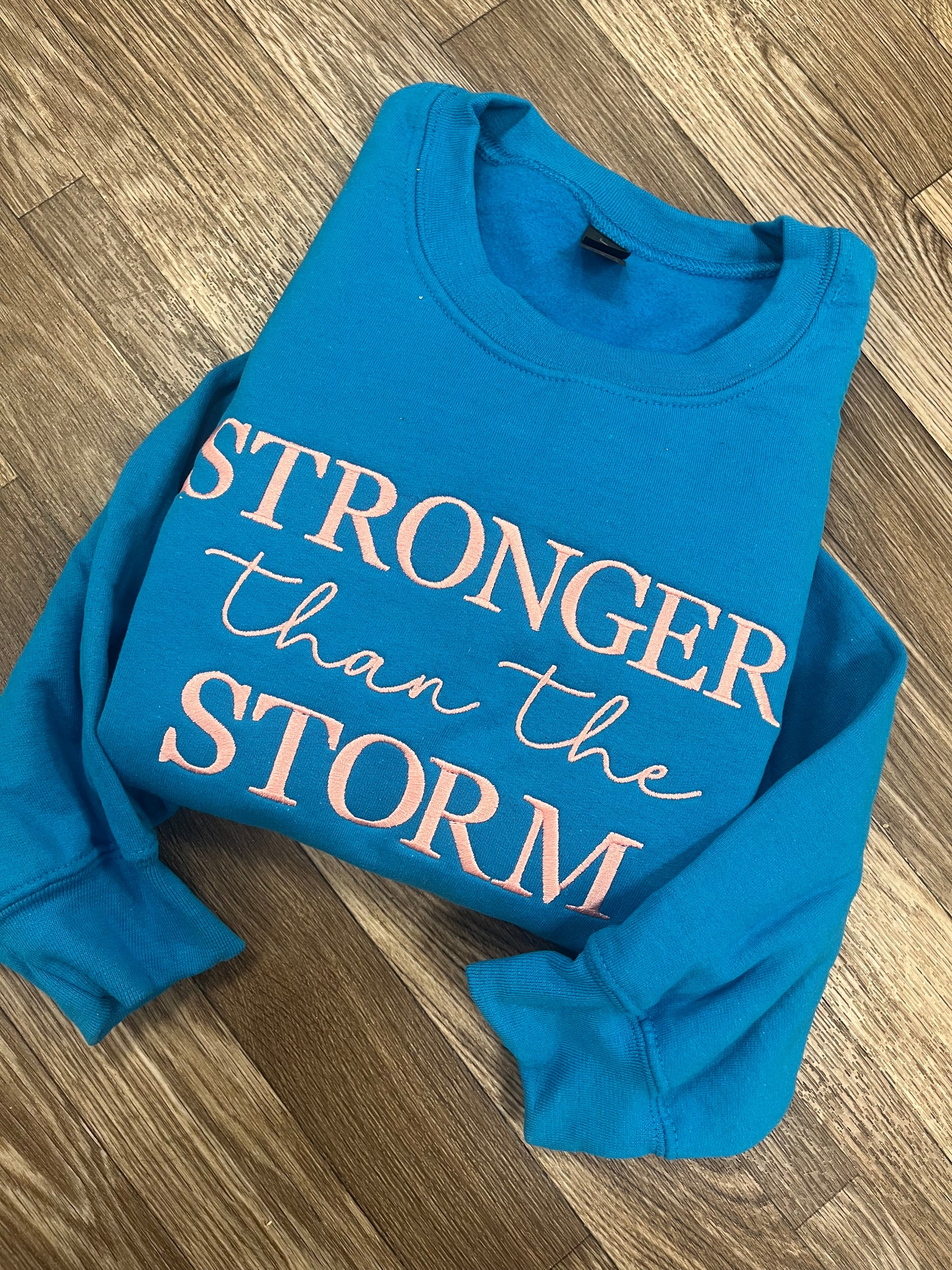 Stronger Than The Storm Crewneck